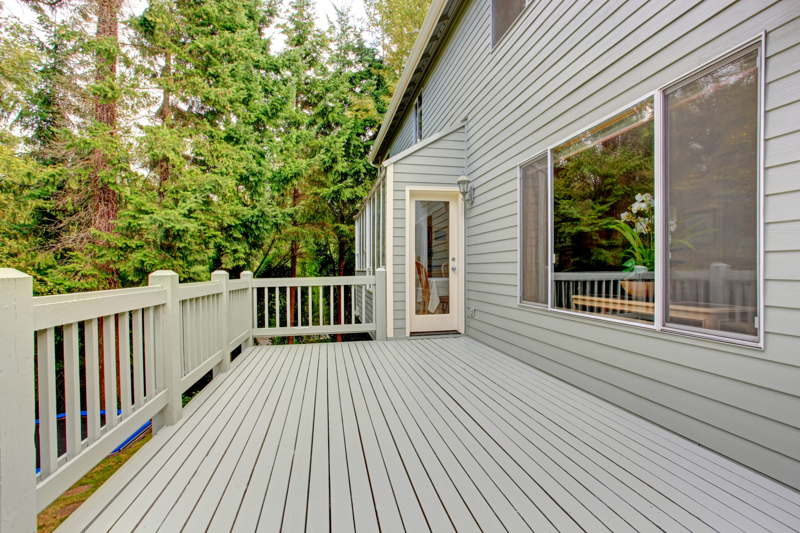 Wooden walkout deck with railings